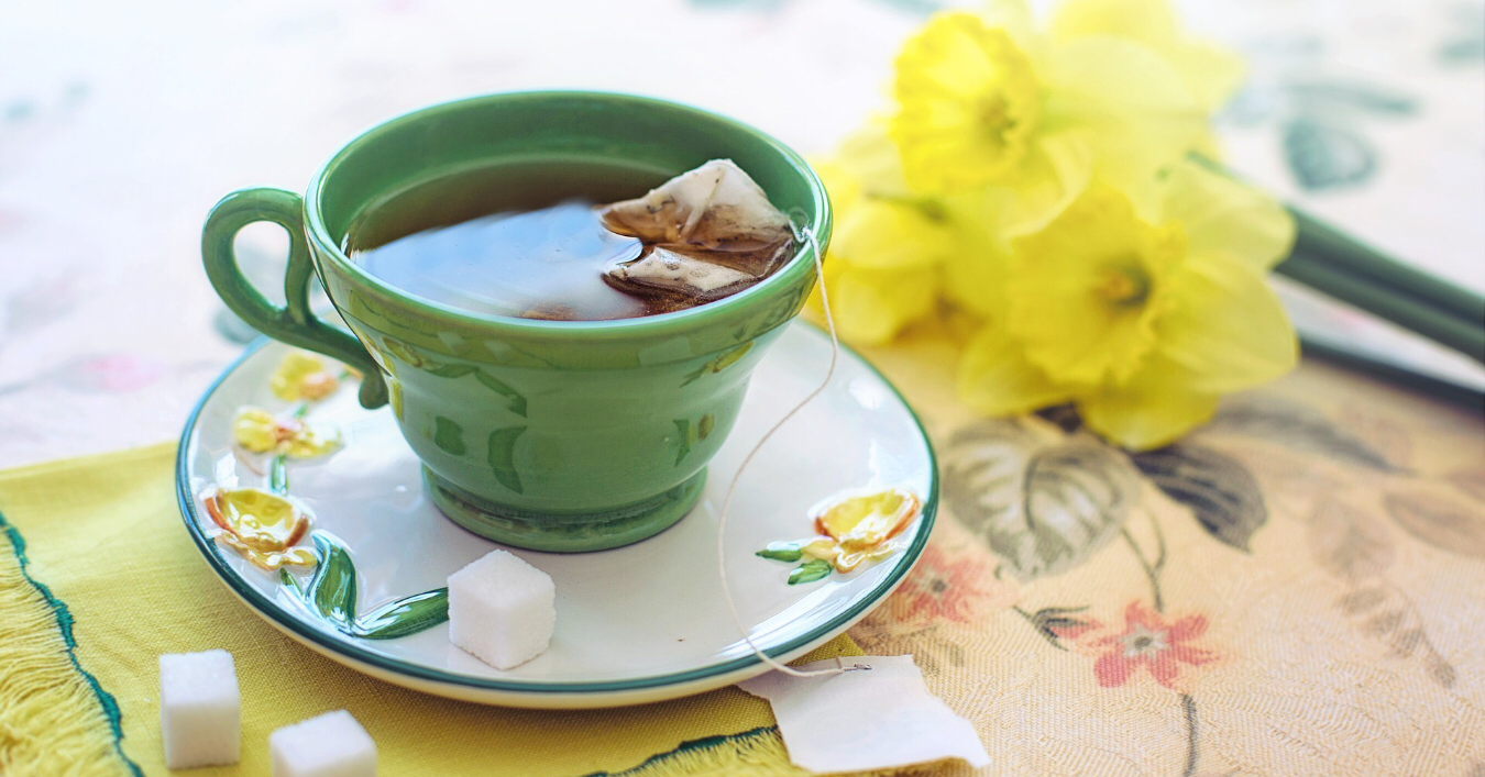 A cup of tea and daffodils