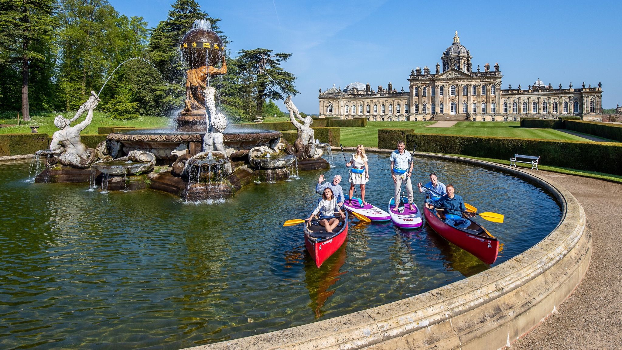 Countryfile presenters in a canoe in a fountain
