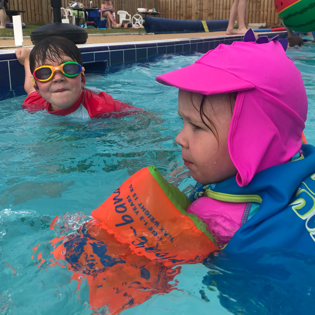 Two children swimming