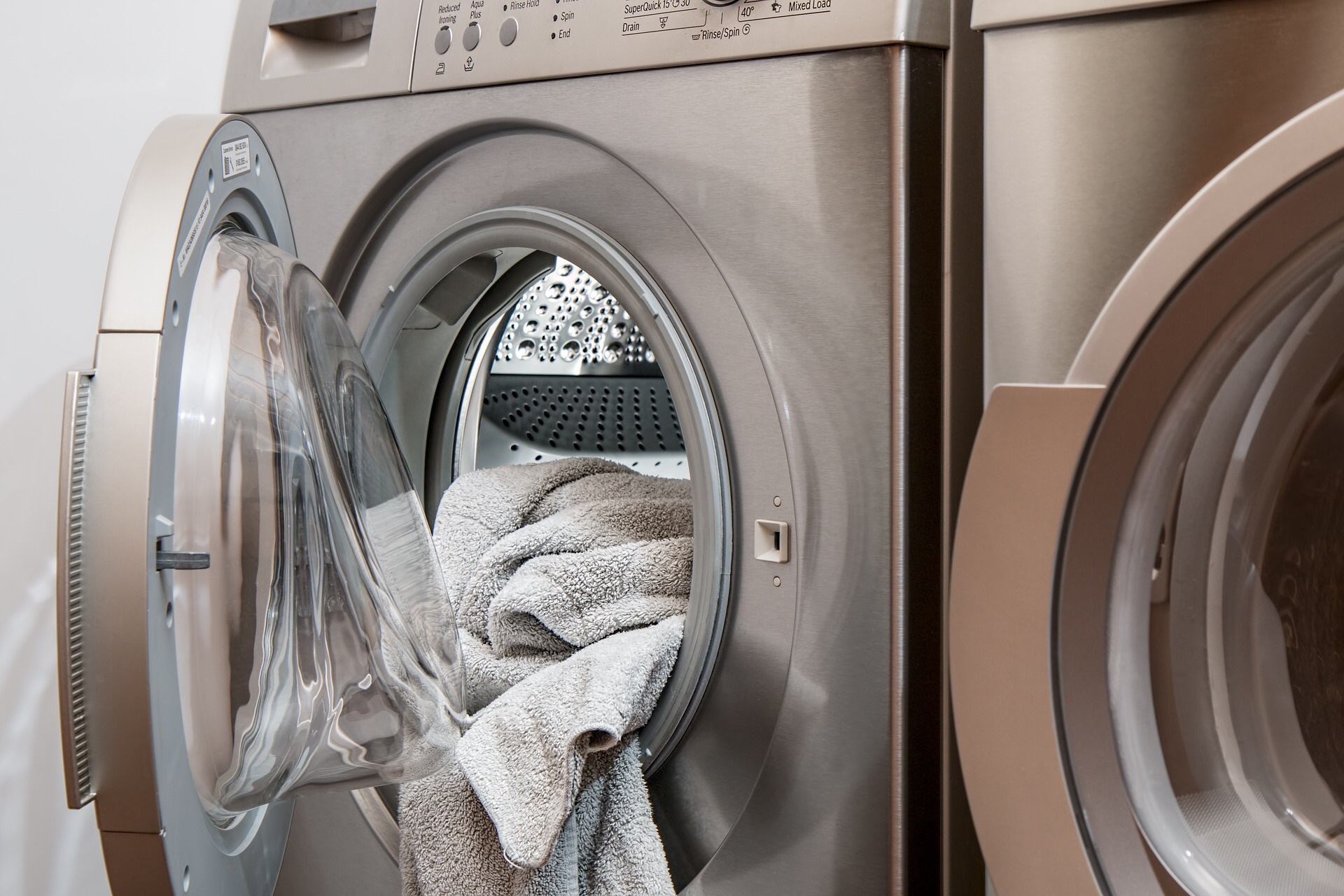 Washing machine with a towel hanging out