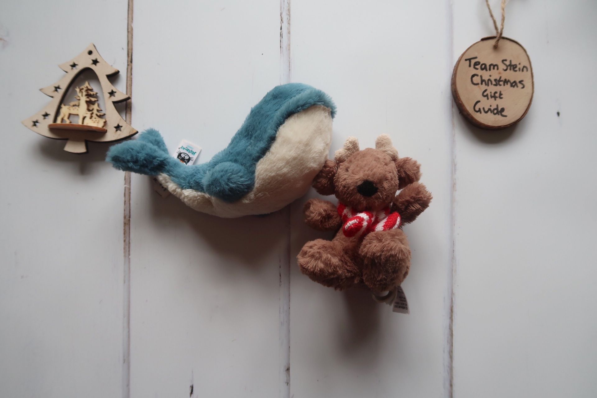 a stuffed toy whale and stuffed reindeer