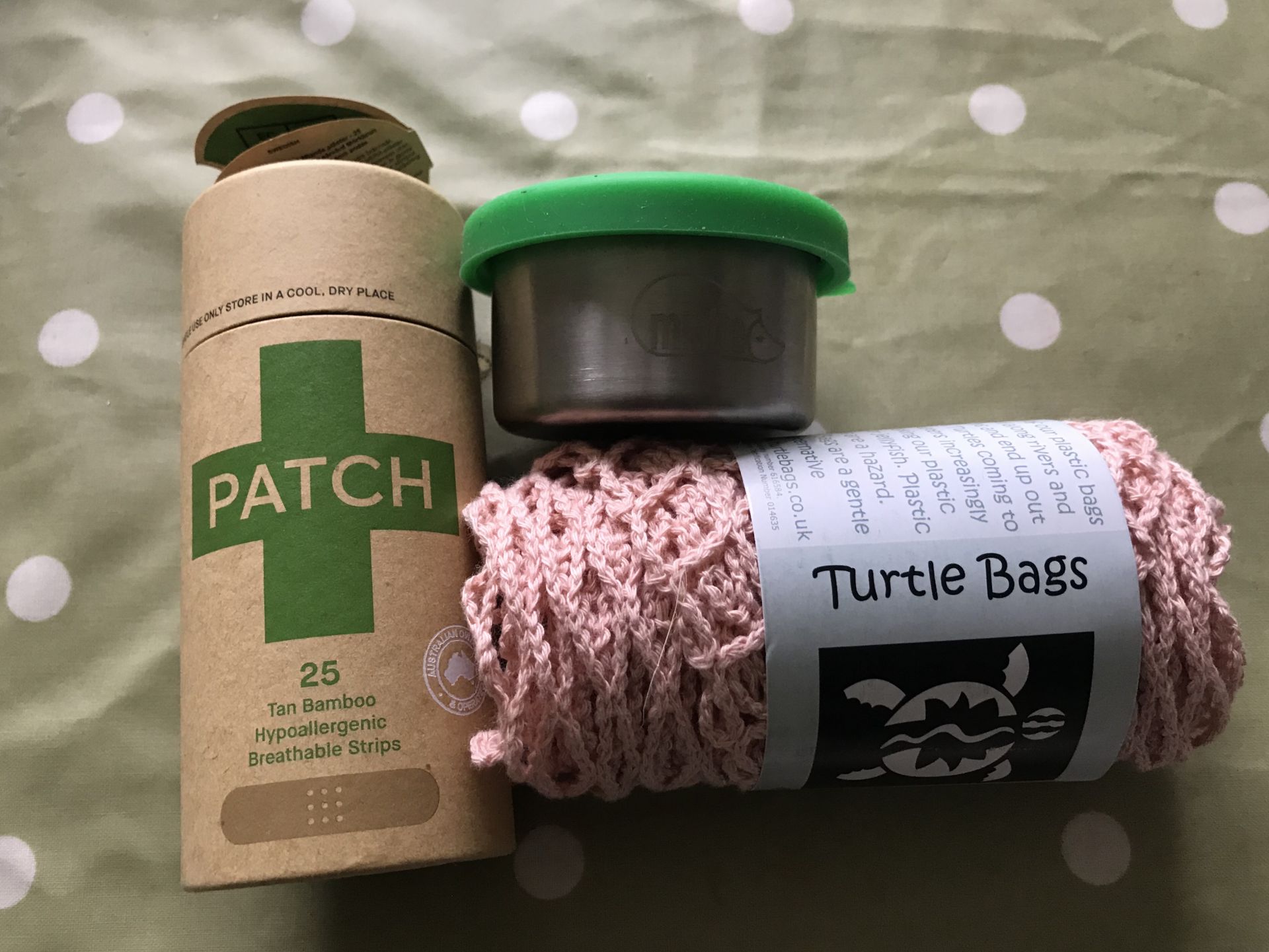 plasters, turtle bag and a stainless steel pot