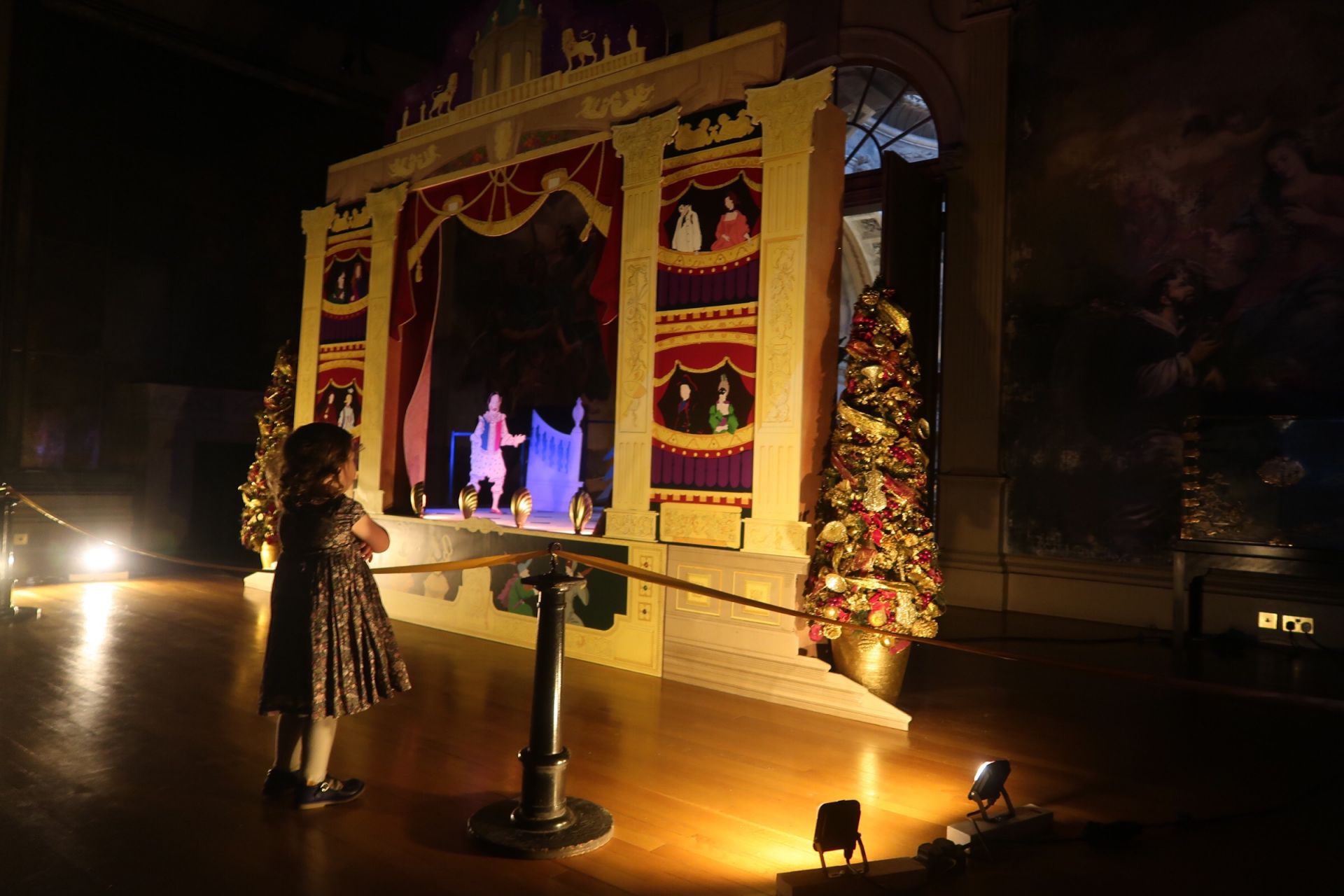 a child looking at a theatre scene