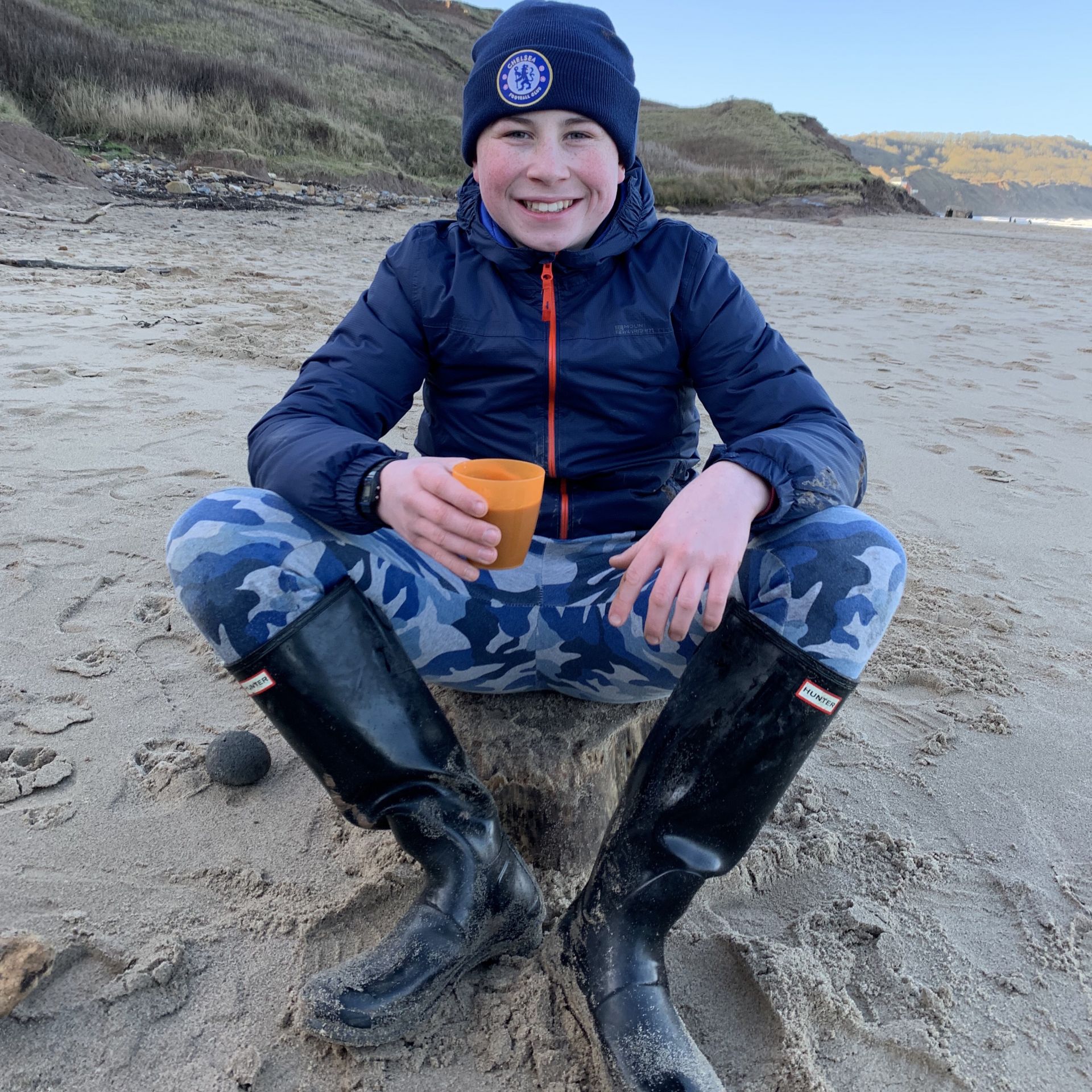 Last living arrows with a boy on the beach smiling 
