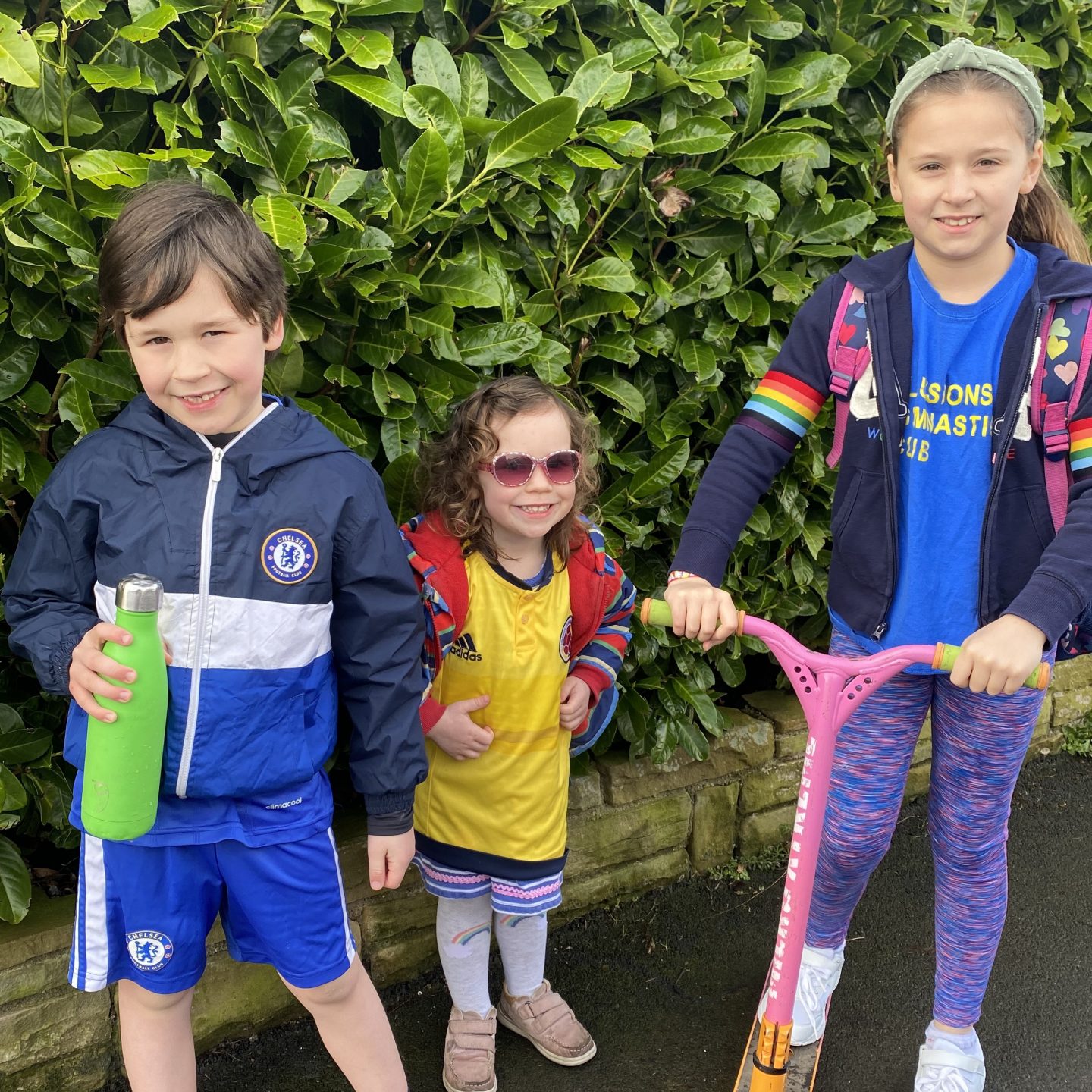 Family life with a photo of 3 children dressed in sports clothing 