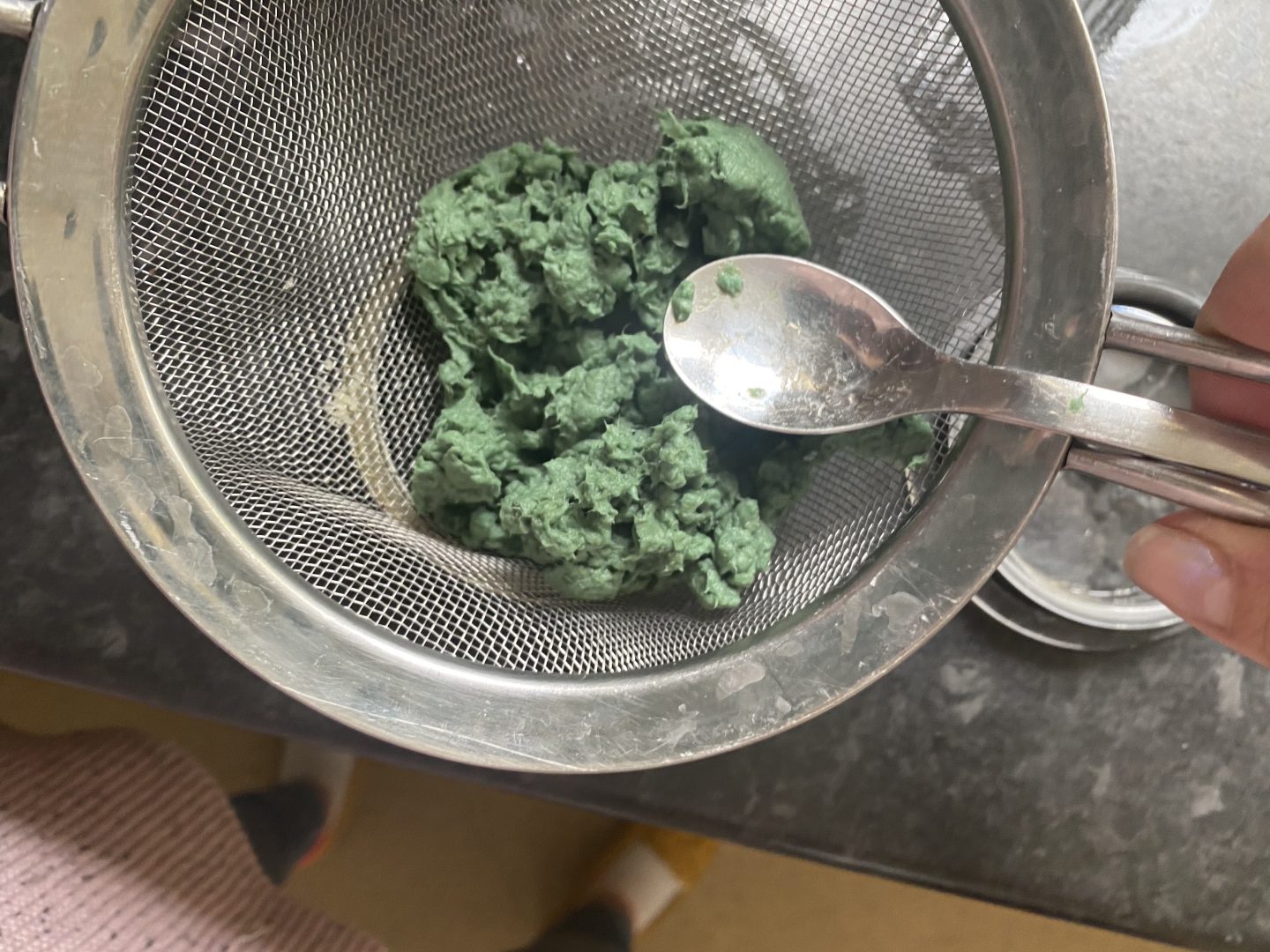 pulped paper in a sieve 
