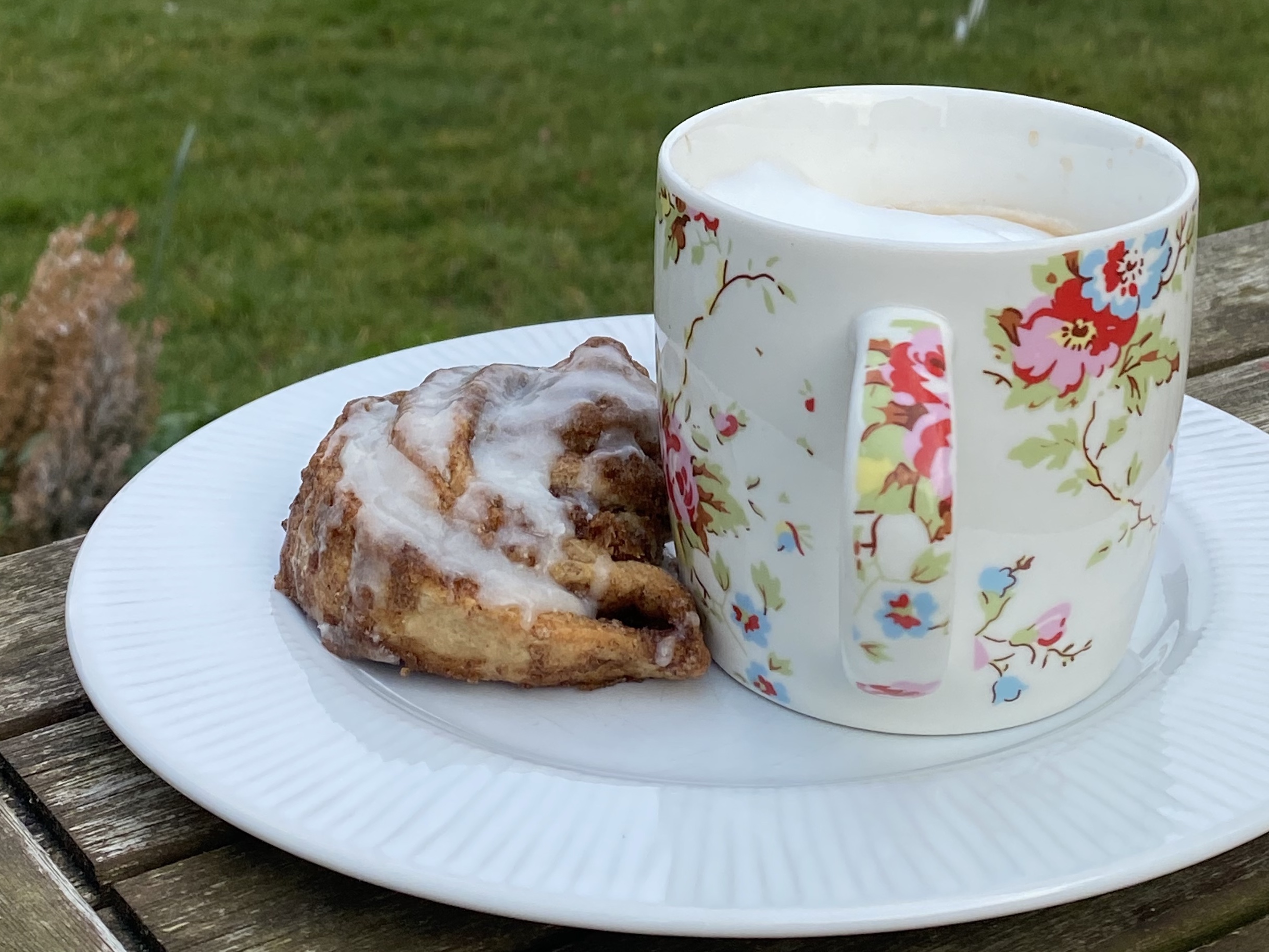 A coffee and cinnamon bun for a self care break 