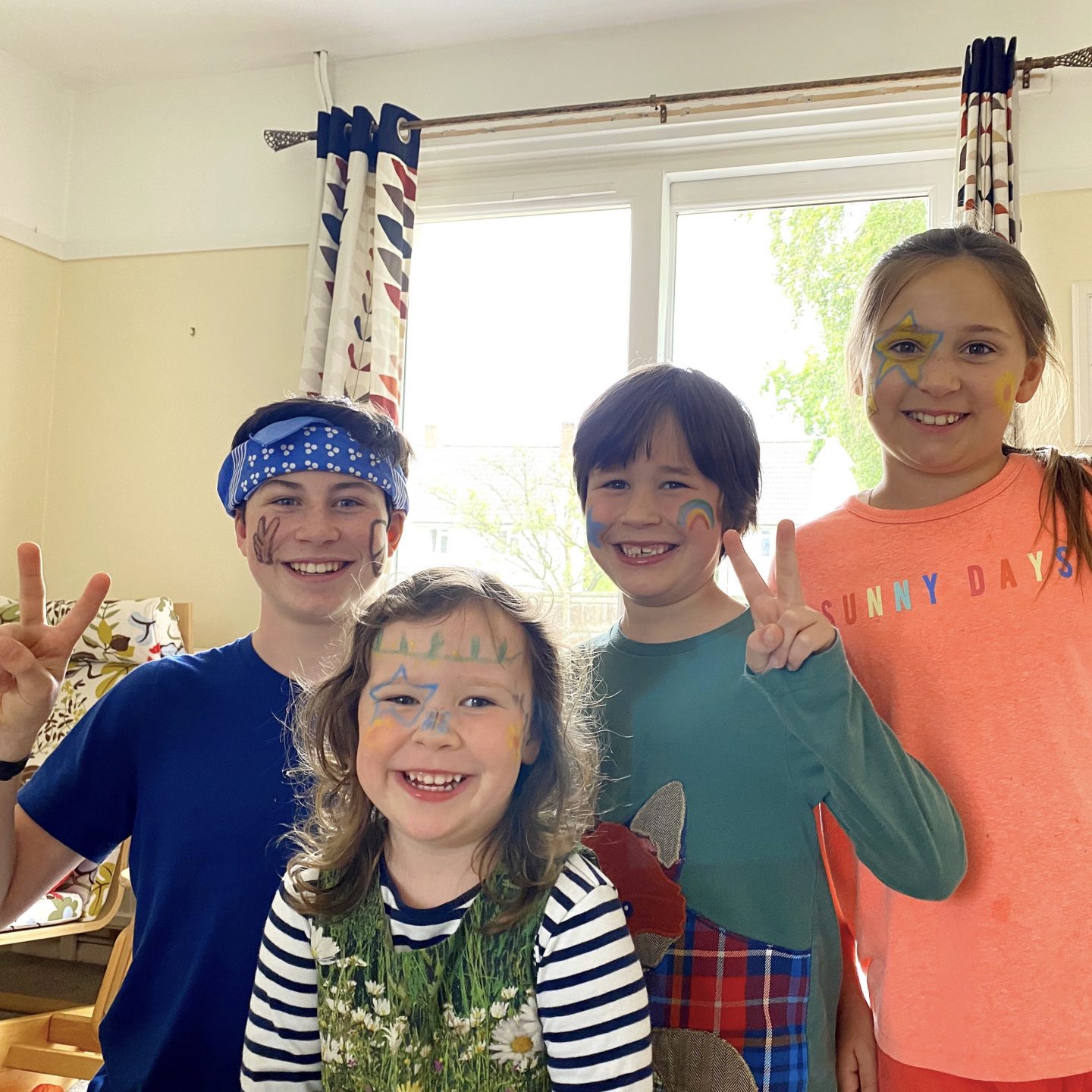 glasthomebury festival with 4 kids with face paint