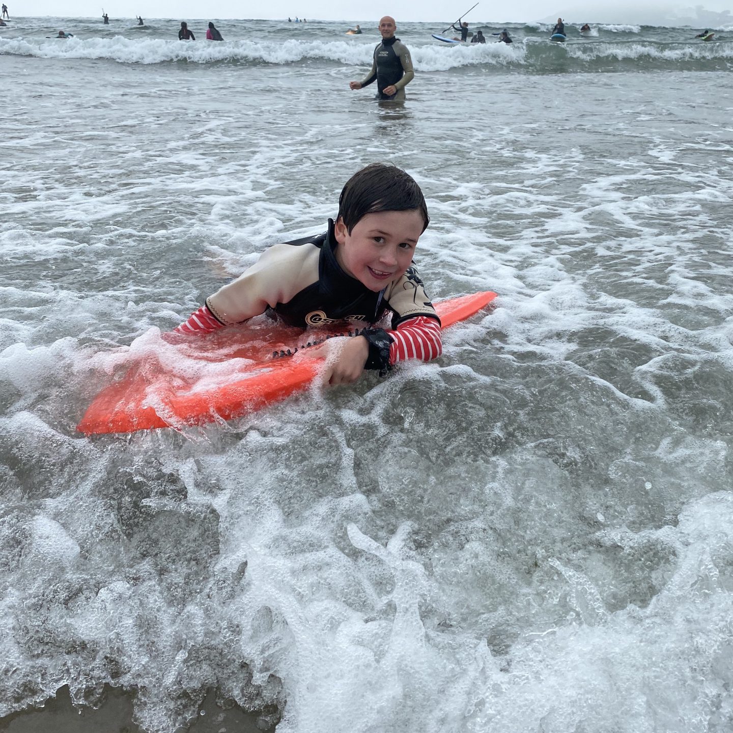 A boy body boarding at Batman beach