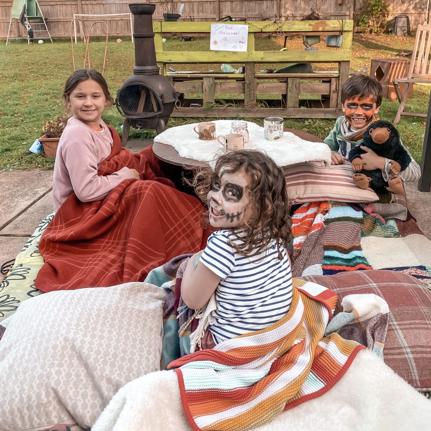 hot chocolates and face paints in teh garden around the fire pit.