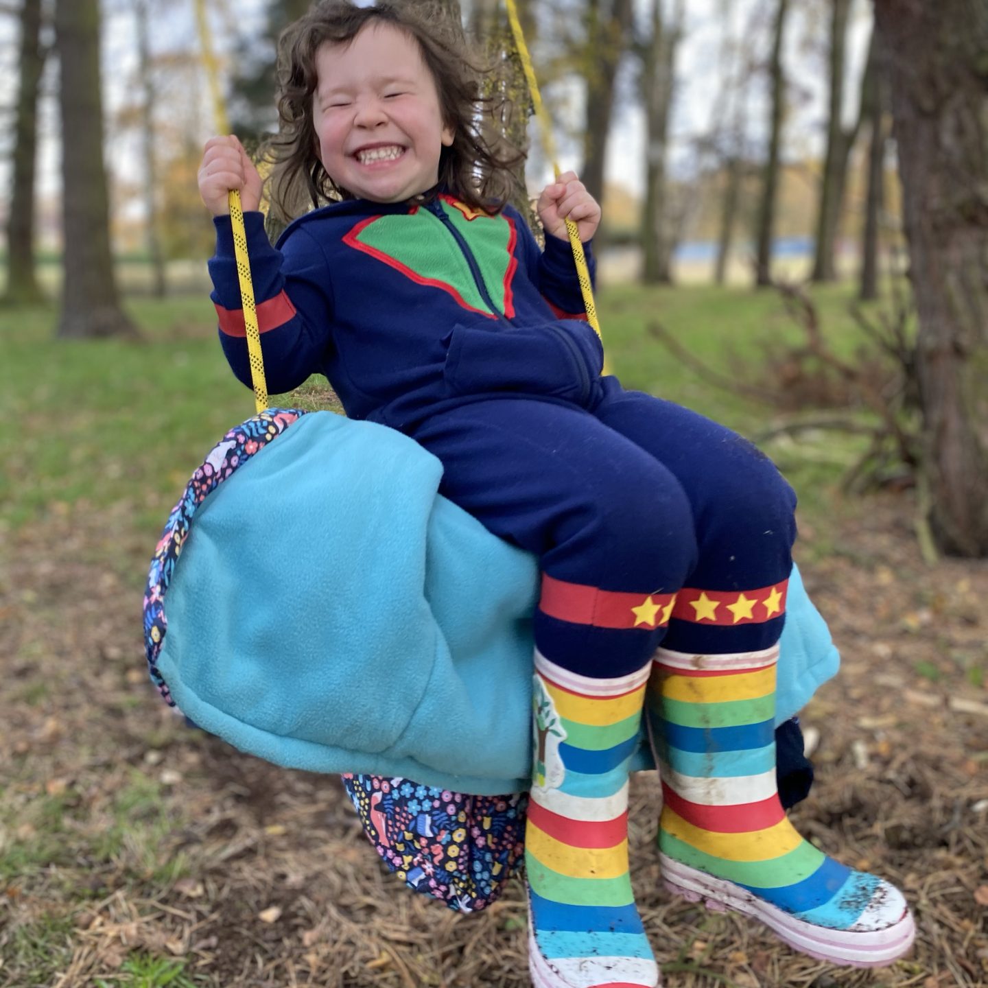 A misty morning walk with a girl playing on a swing 
