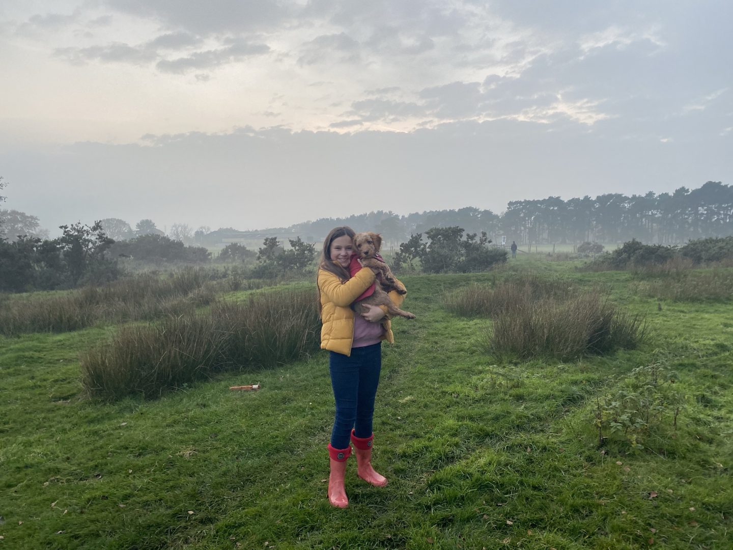 A misty morning walk with a girl walking her dog 