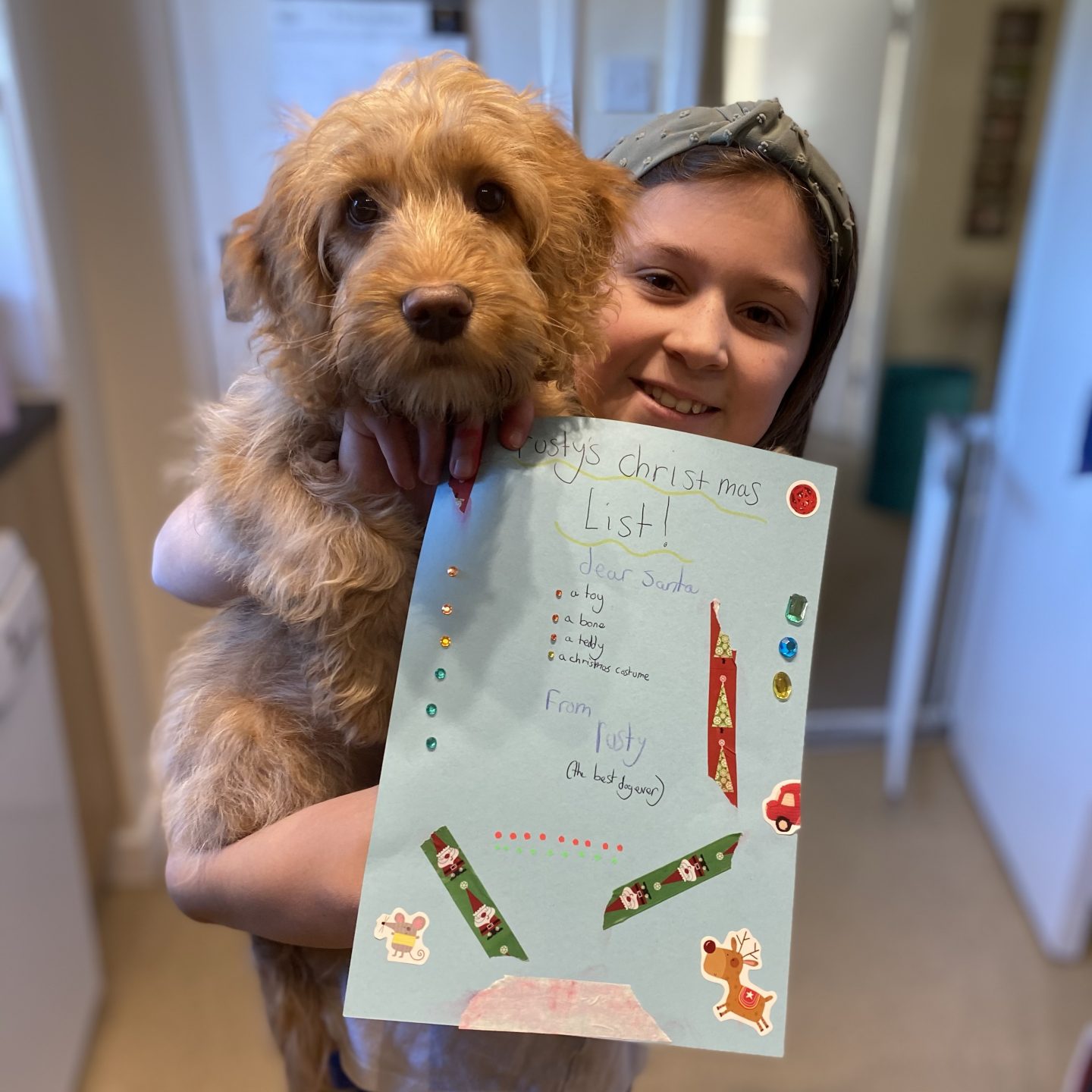 writing letters to Santa with a child and a dog with their Santa letters 