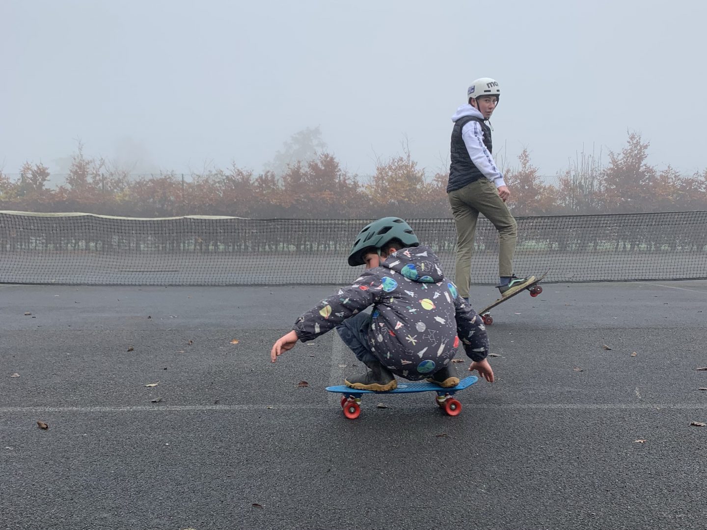 two boys skateboarding 