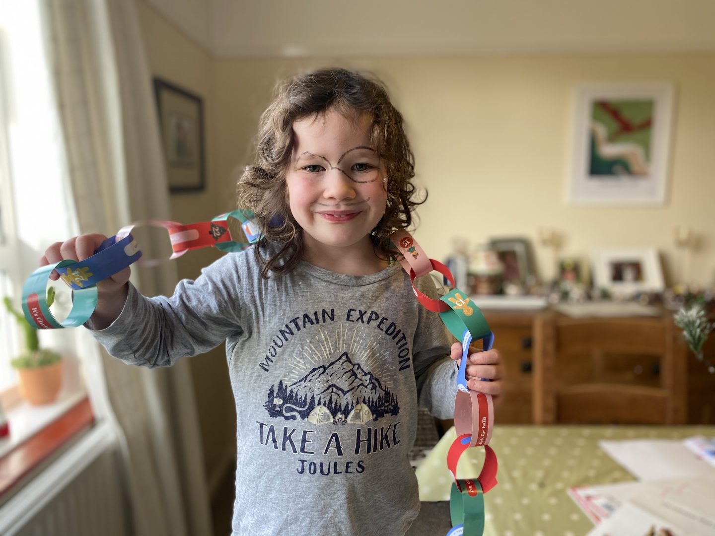 A little girl holding her paperchains