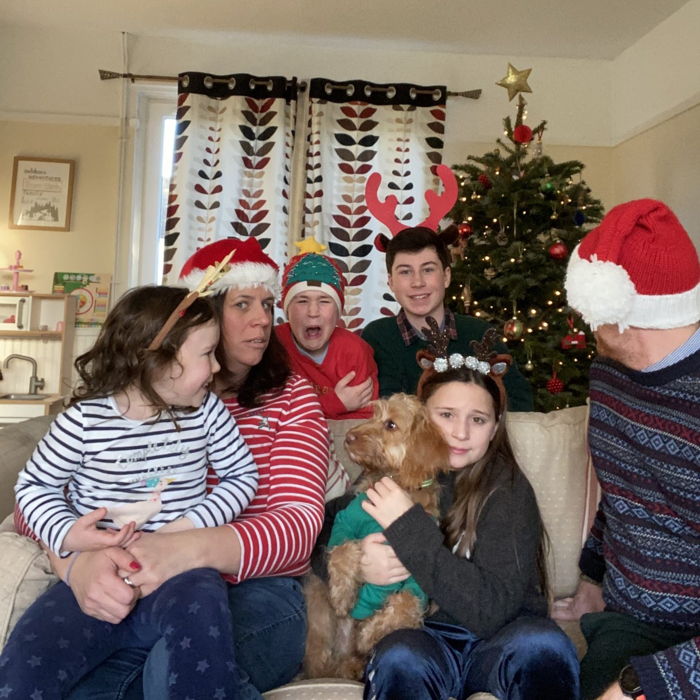 Last living arrows with a family photo with a child crying and one laughing 