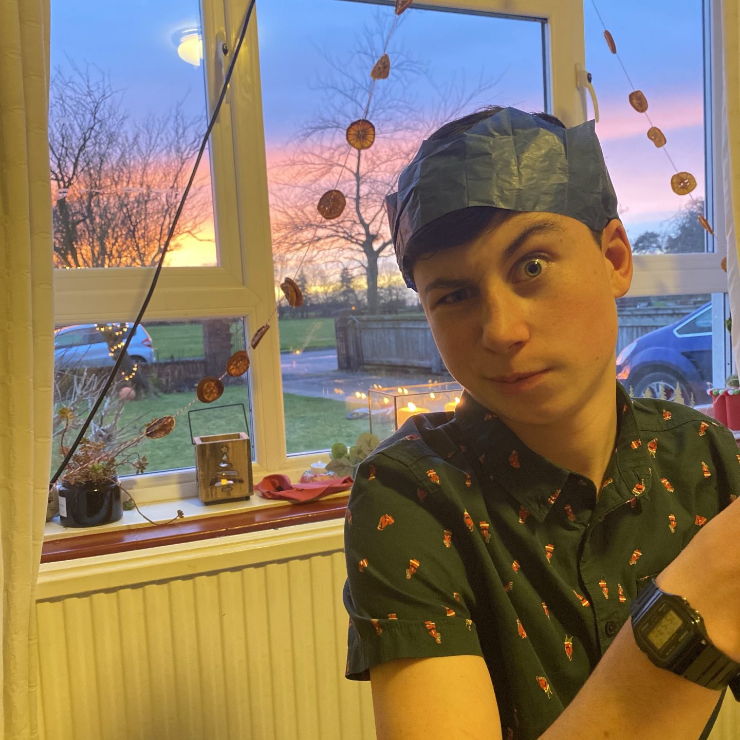 A young boy pulling a funny face on Christmas Day 