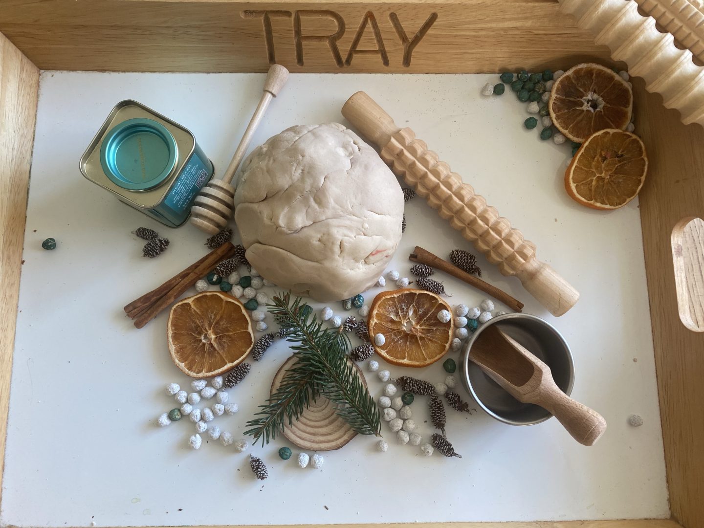 natural play dough with foliage and wooden tools
