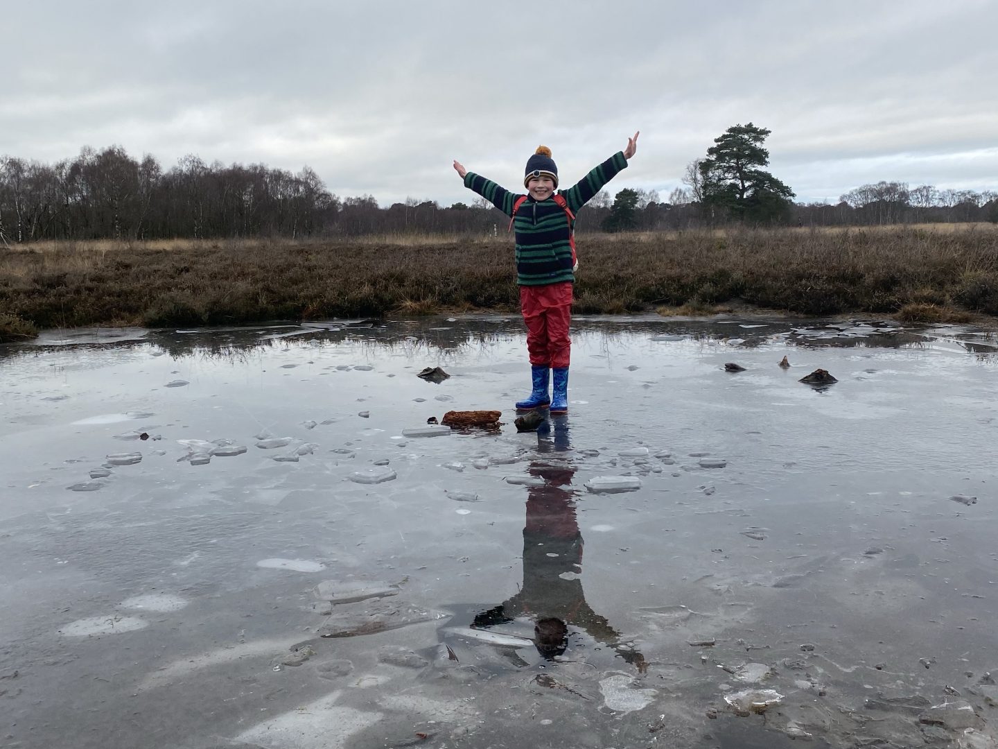 A boy standing on the ice