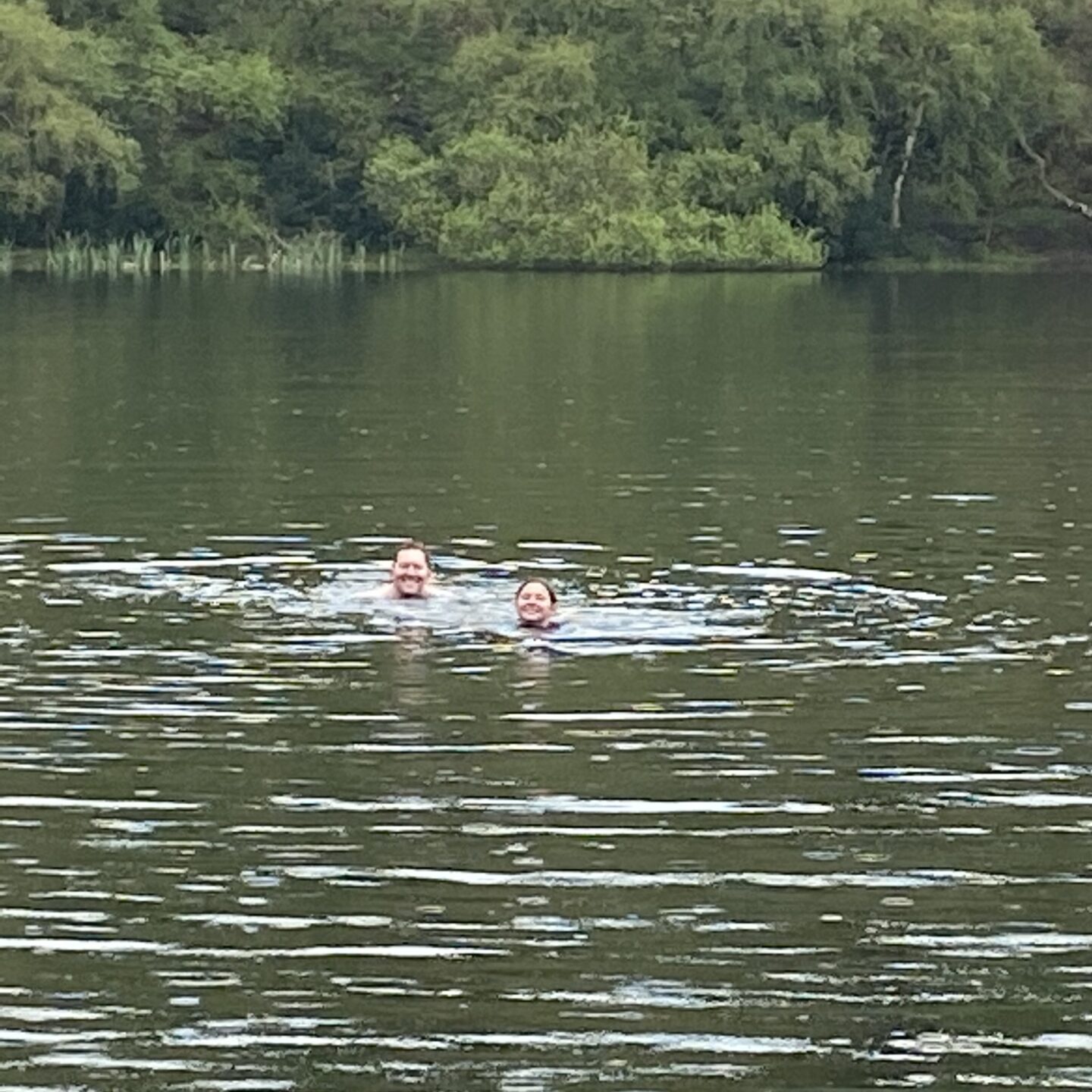 2 people wild swimming in Lake Gormire