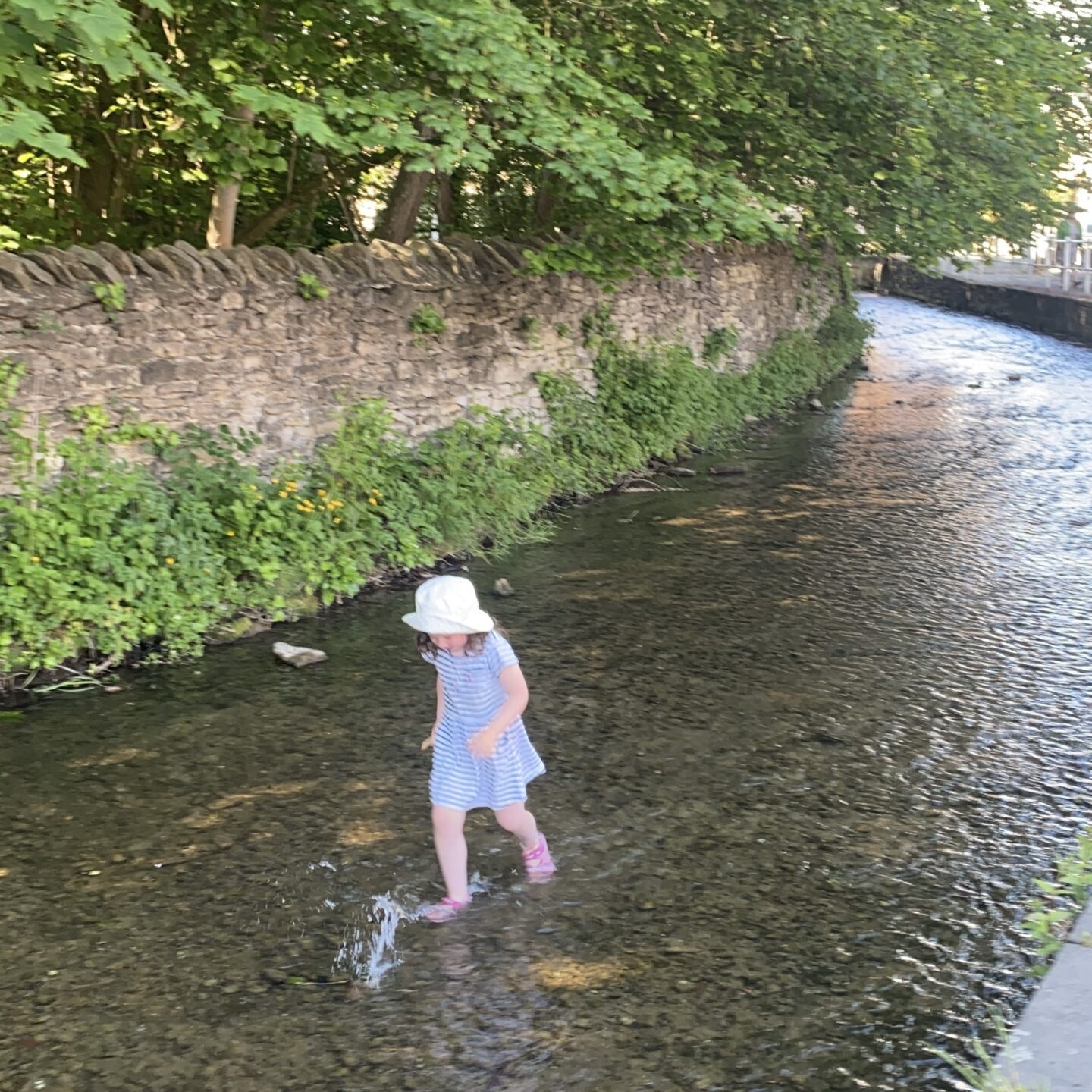 Paddling at Thornton le Dale with a little girl in the river