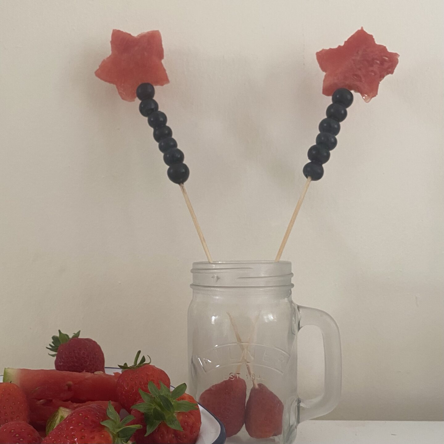 Watermelon stars on kebab sticks with blueberries on