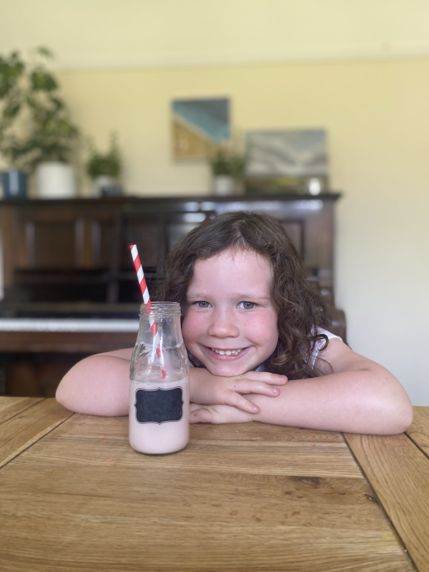 Schools out for summer with a girl drinking a milkshake