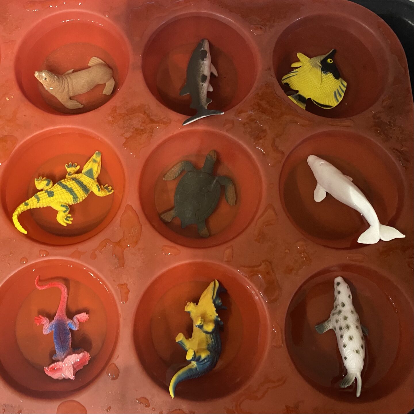 ice play with frozen water and attic toys. August activities for kids