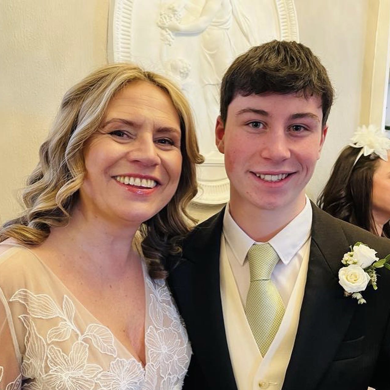 Wedding weekend with a teenage boy in his usher suit with the bride