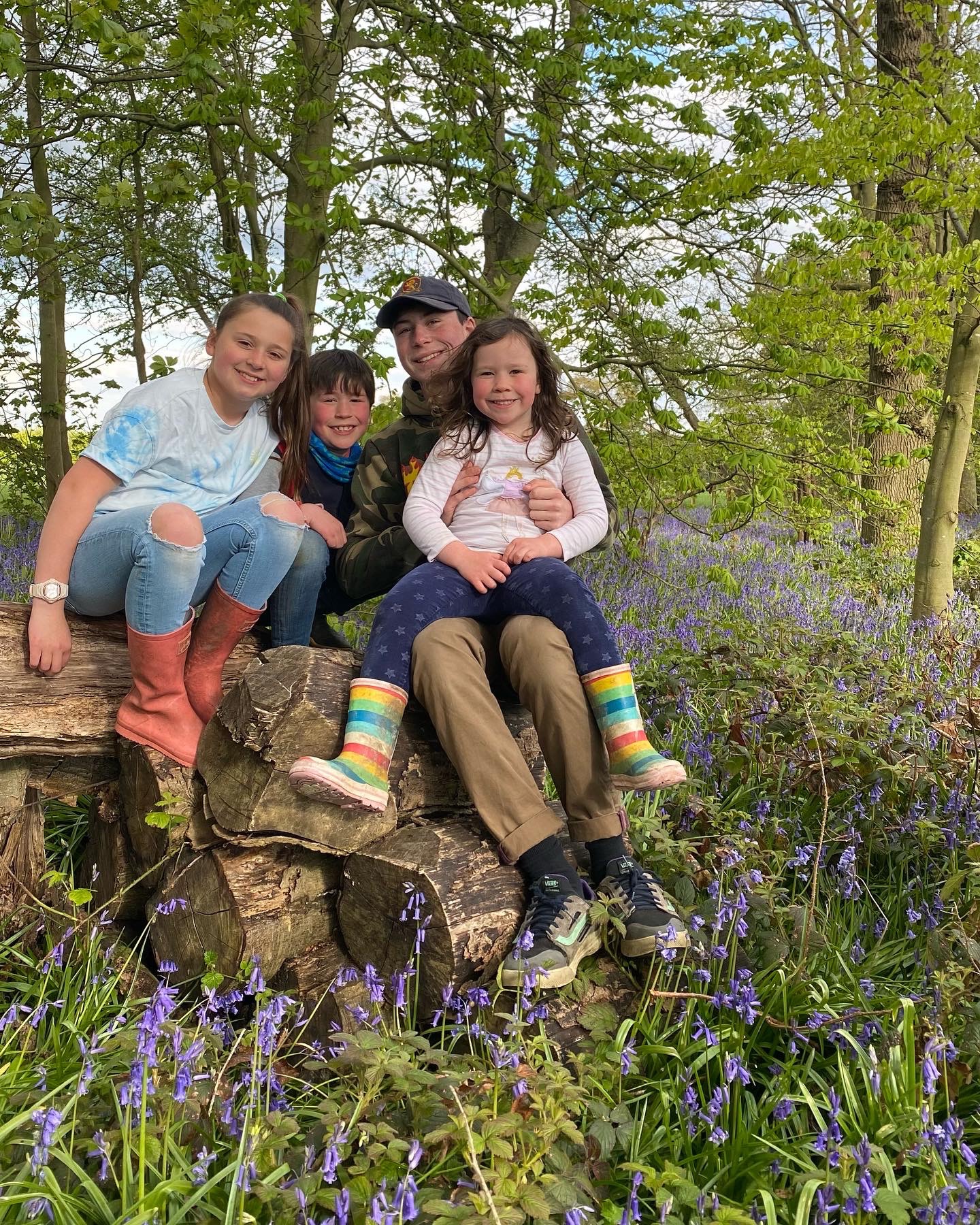 beningbrough woods bluebells with 4 kids on a log