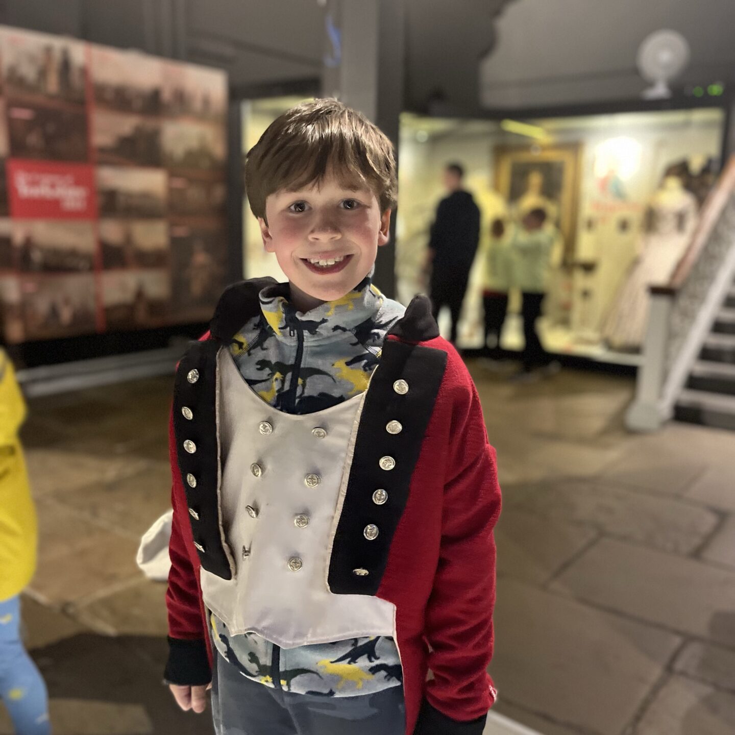 a boy dressed up in victorian costume in a York museum visit