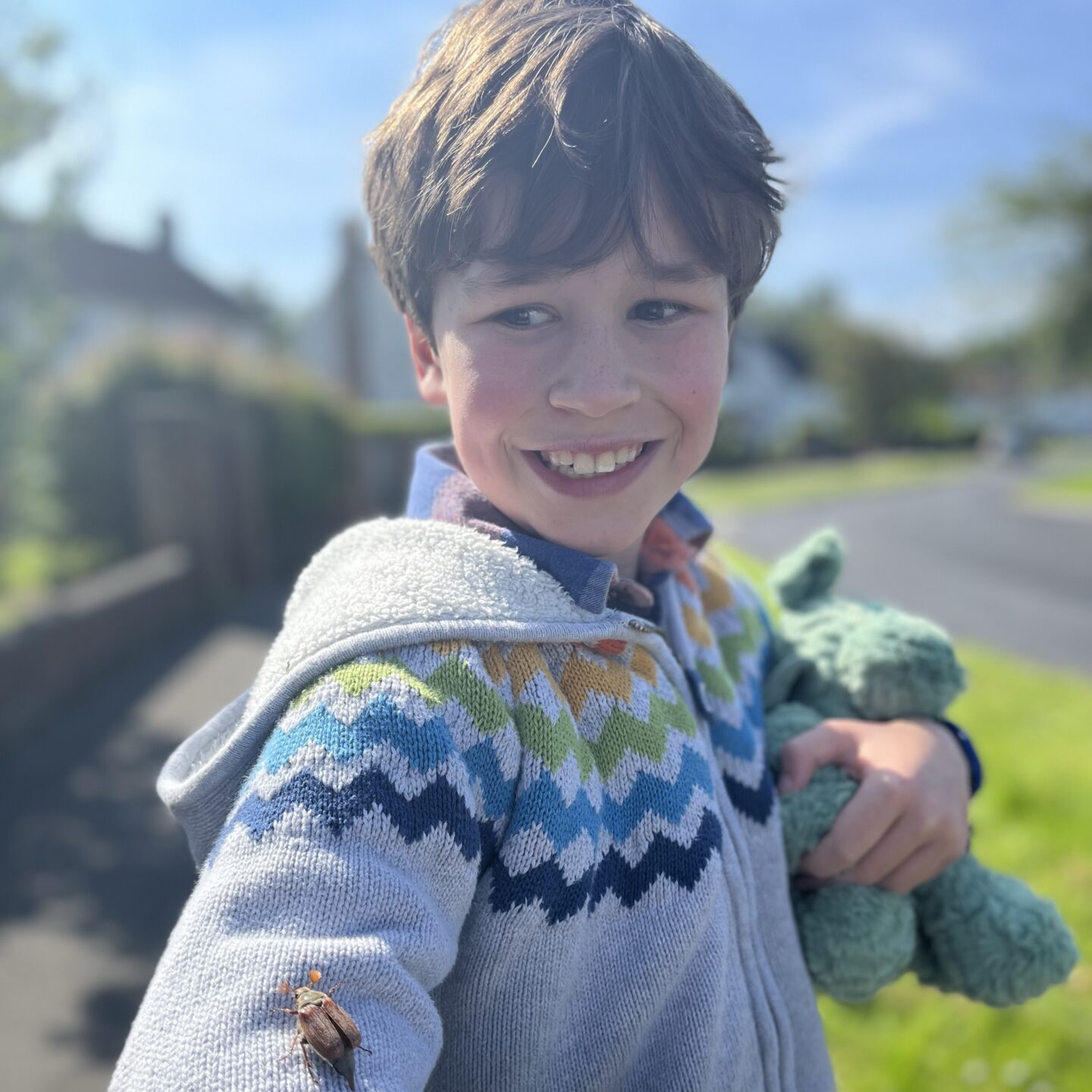 30 days wild with a young boy holding an insect