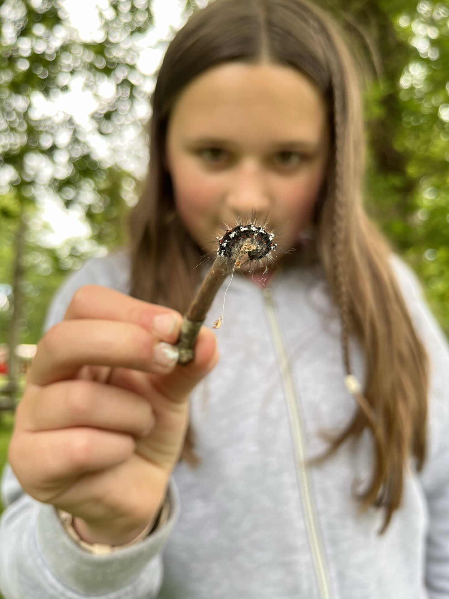 30 days wild with a girl holding a caterpillar