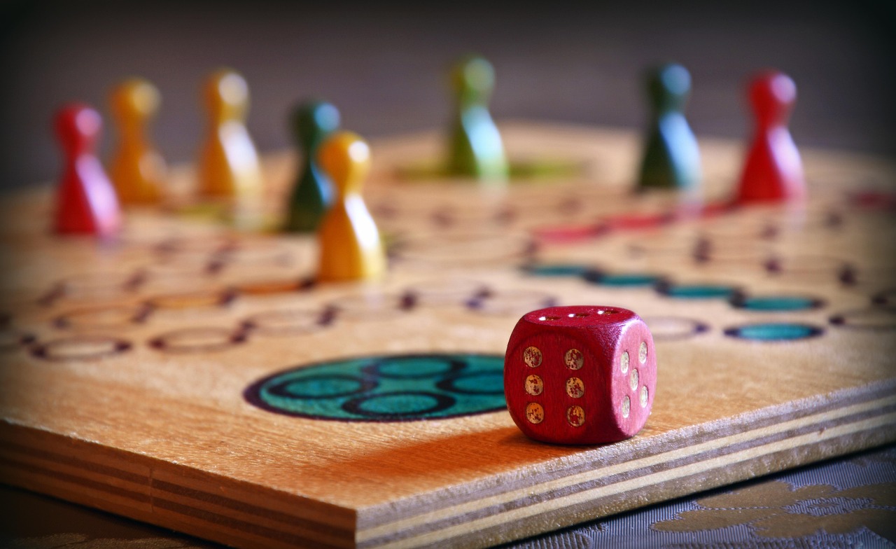 family game night with a games board and dice 
