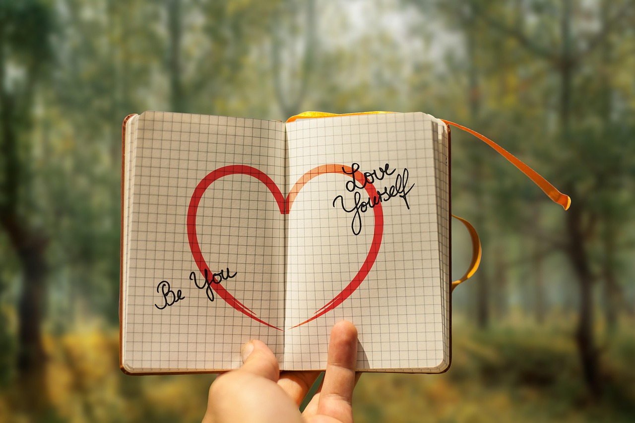 fatigue that won't go away -a book with a heart saying love yourself in a forest