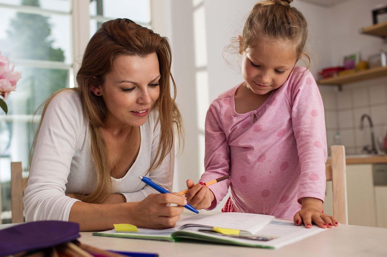 Mother and daughter learning together, showcasing how parents can model a love of learning